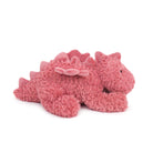 Pink plush dragon toy lying down.