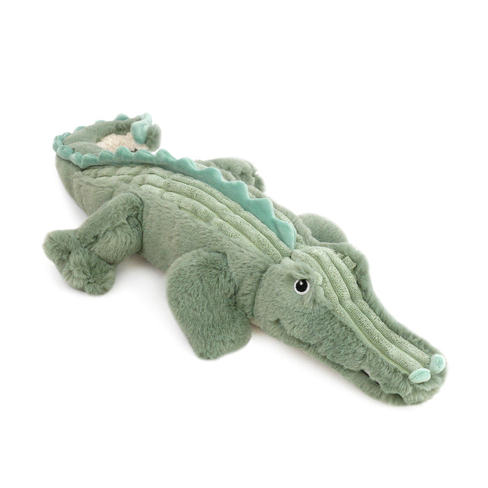 Plush toy alligator on a white background