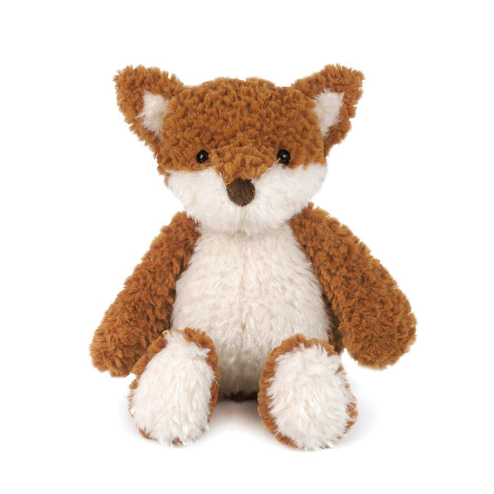 Brown and white plush fox toy sitting.