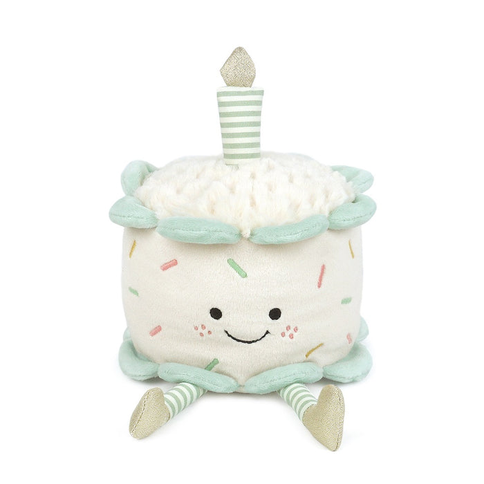 Plush birthday cake with a smiling face.