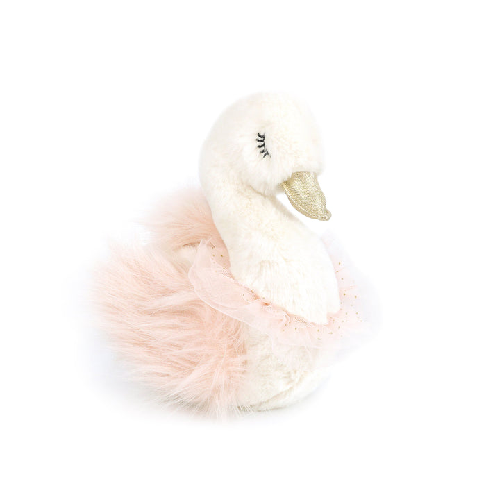 A stuffed swan toy with a golden beak and a pink tutu.