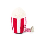 Stuffed popcorn bucket toy with striped legs and gold shoes.