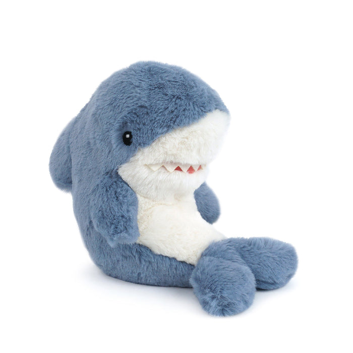 Blue and white plush shark toy sitting.