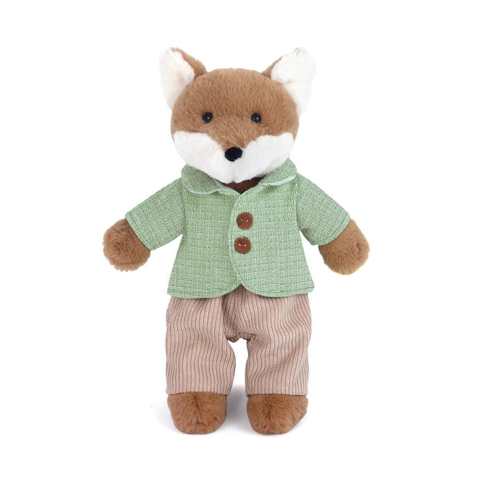 Stuffed toy fox wearing a green jacket and brown pants on a white background