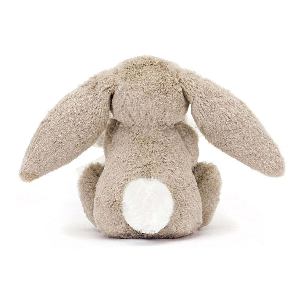 Back of a brown stuffed bunny toy with a white tail.