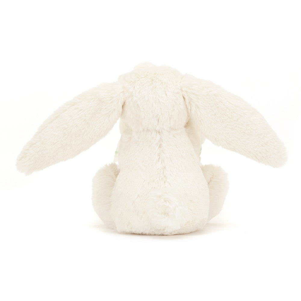 Back view of a fluffy, white bunny plush toy with long ears and a small tail.