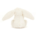 Back view of a fluffy, white bunny plush toy with long ears and a small tail.