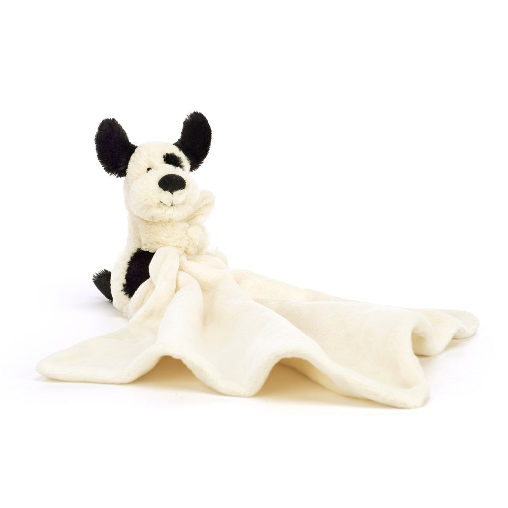 Ivory and black plush dog comforter toy.