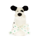 Stuffed dog and rolled blanket tied with ribbon.