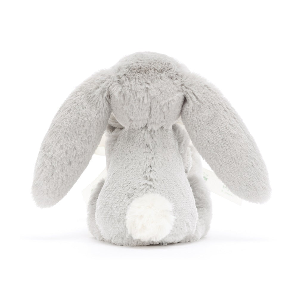 Rear view of a gray stuffed bunny with long ears and a white fluffy tail.