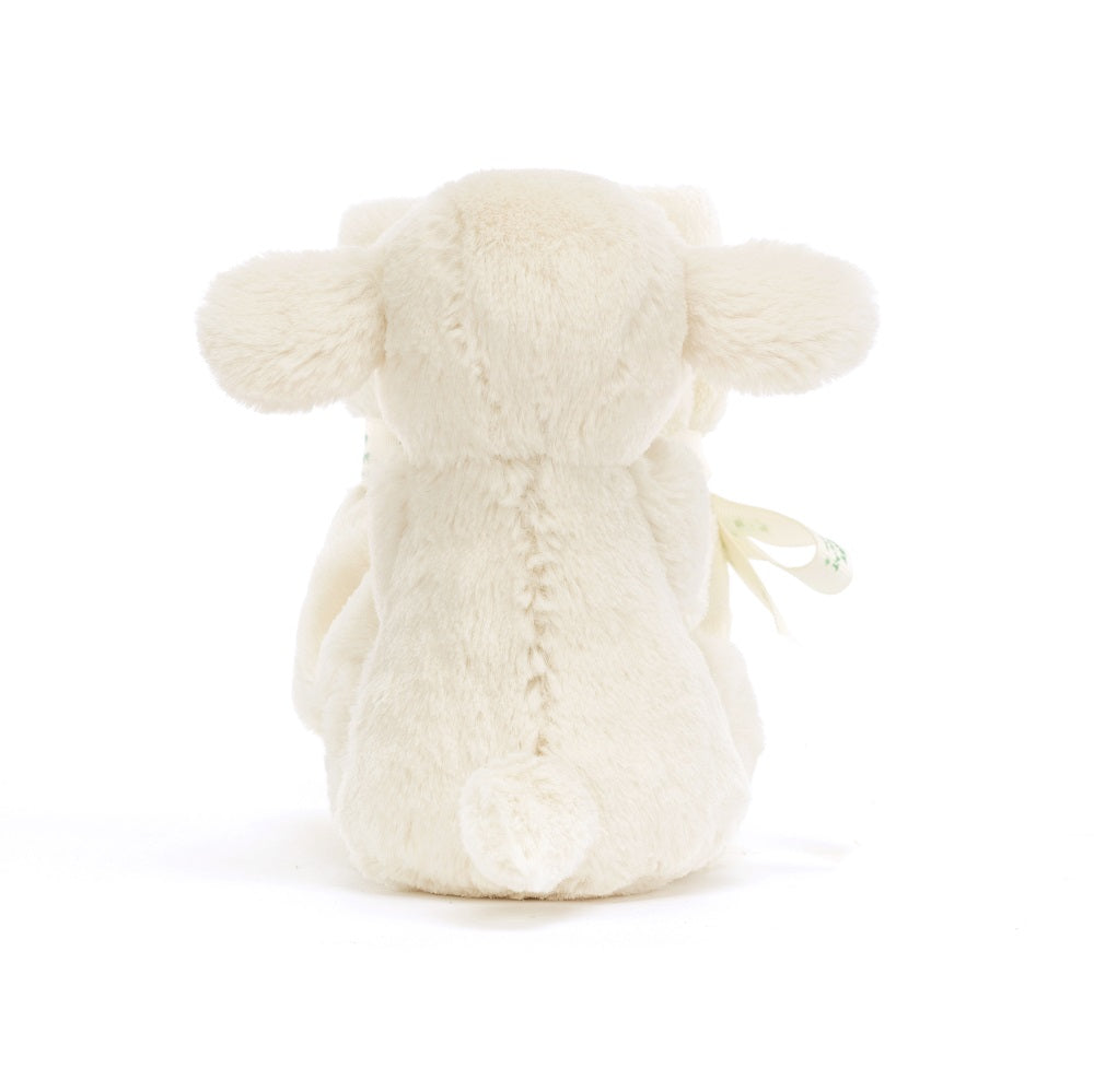 Rear view of a stuffed, cream-colored lamb with a short tail.
