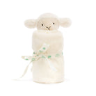 A plush cream-colored lamb toy wrapped in a matching blanket and tied with a Baby Jellycat ribbon.