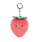 Plush strawberry keychain with a smiling face on a white background