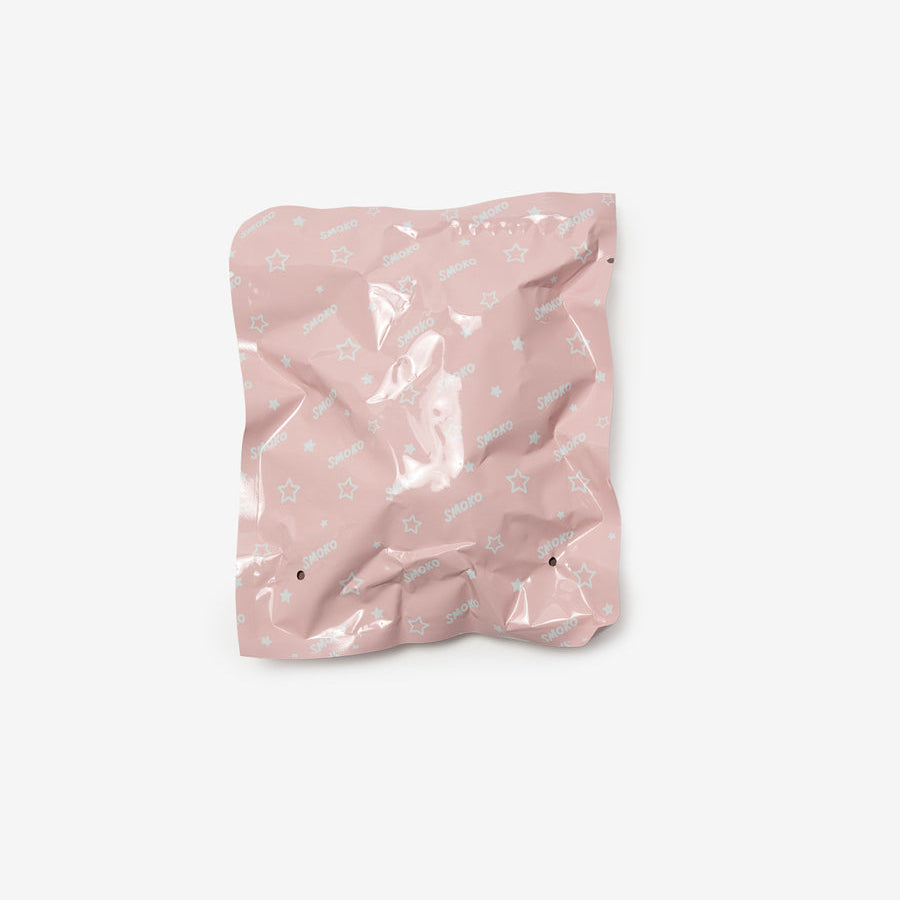 Pink crumpled paper bag on a white background