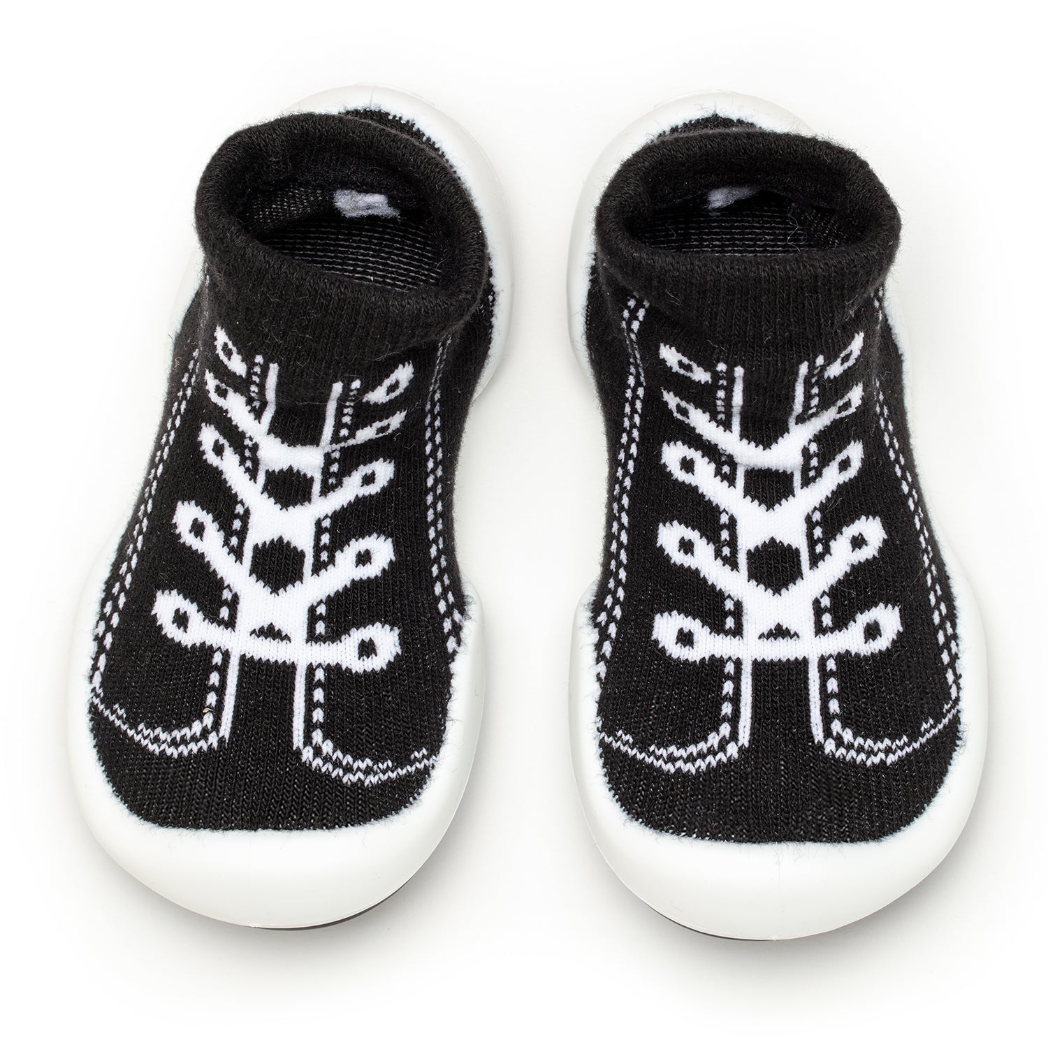 Two black and white baby sock-shoes.