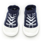 Pair of navy blue and white sock shoes.