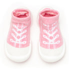 Pink and white baby sock shoes.
