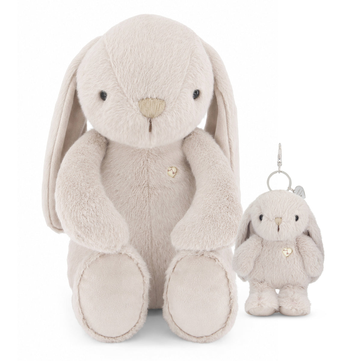 A plush bunny toy in a light oatmeal beige color, shown next to a matching small plush keychain with a silver metal clip, on a solid white background.