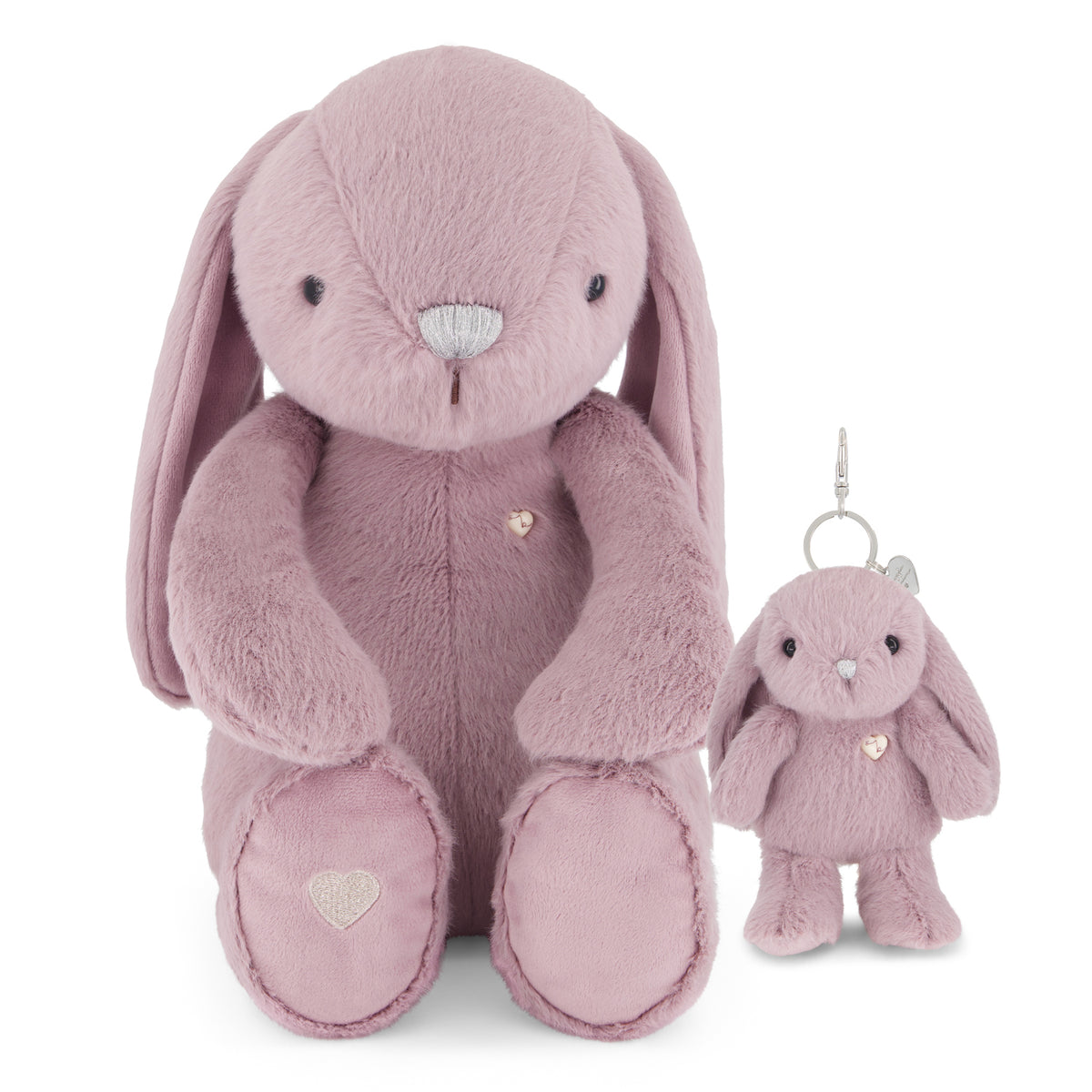 A soft plush bunny toy in dusty pink, shown seated next to a smaller matching plush keychain with a silver metal clip, on a clean white background.