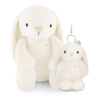 Two plush white bunny toys: a larger seated bunny and a smaller bunny keychain.