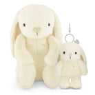Two ivory plush bunny toys, one seated and larger, the other a keychain.