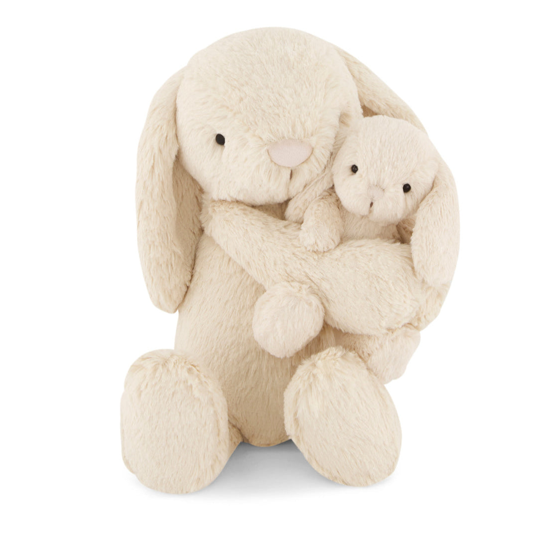 Stuffed bunnies, creamy-white plush.