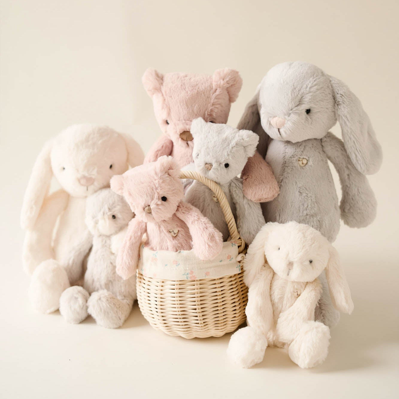 Collection of stuffed animals in a basket.