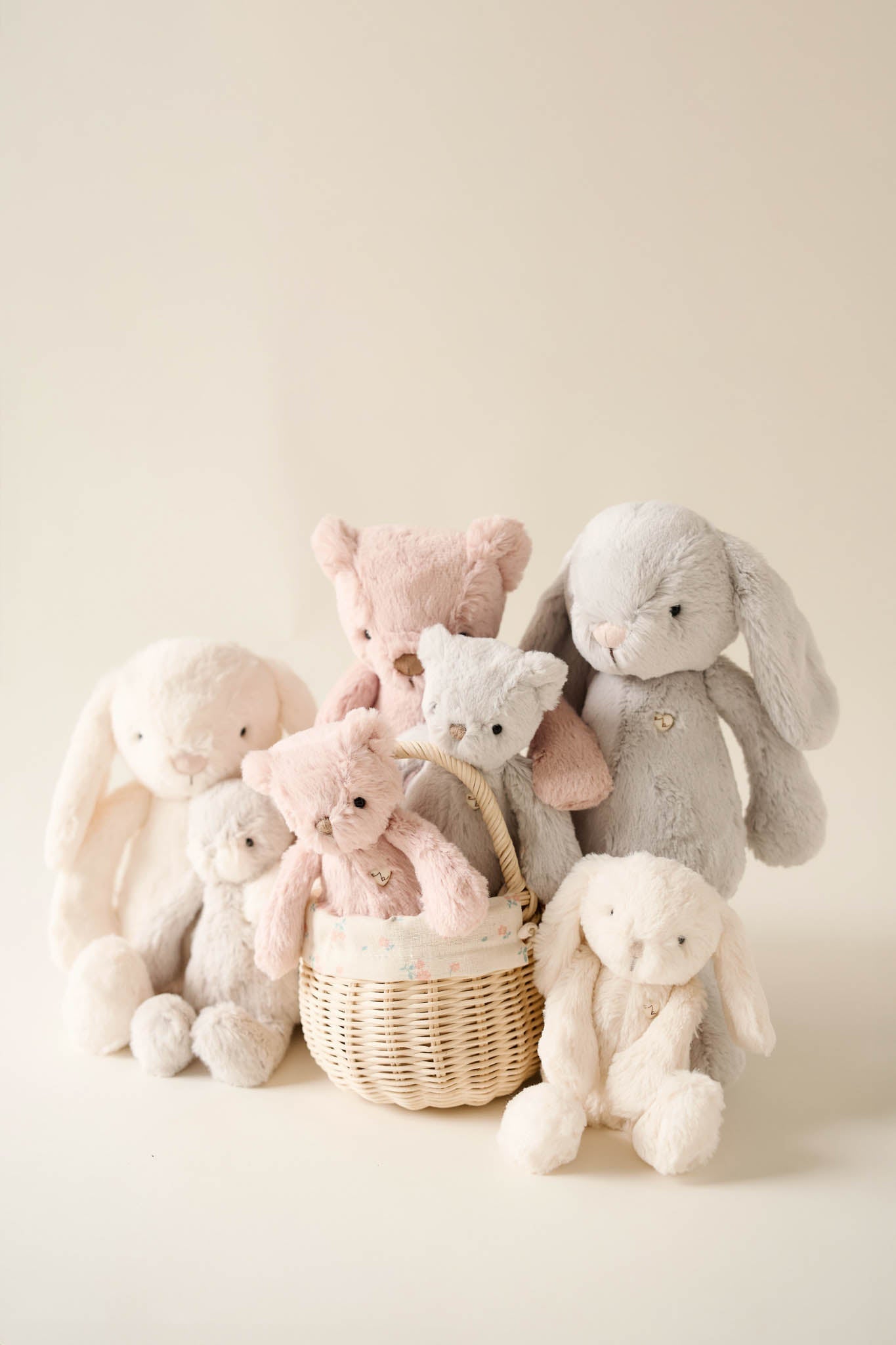 A basket of plush toys in various colors.