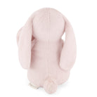 Rear view of a pink plush bunny with long ears and a small tail.