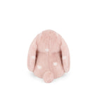Back of a pink plush bunny with white hearts.