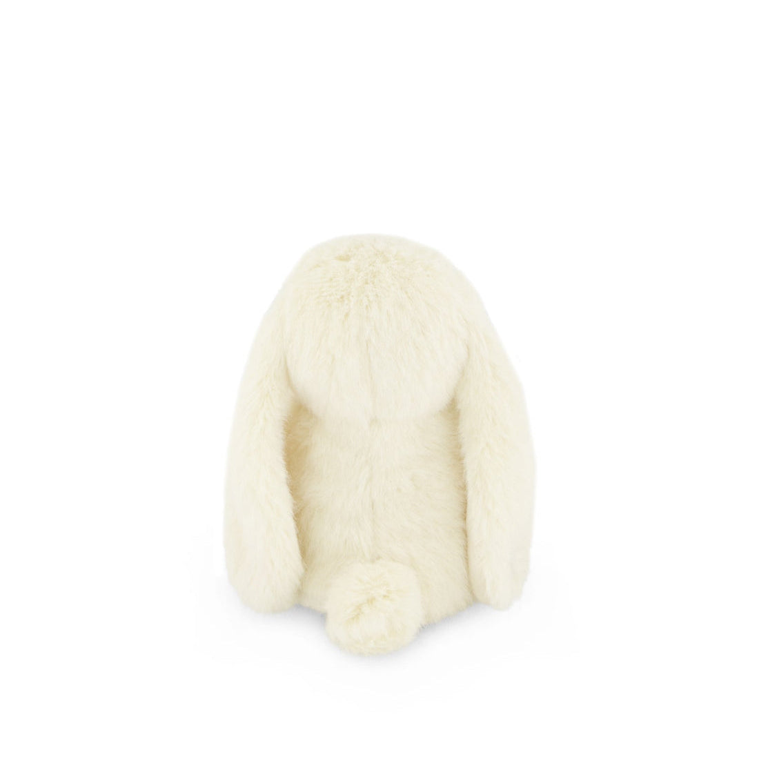 Rear view of a fluffy, cream-colored stuffed bunny toy.