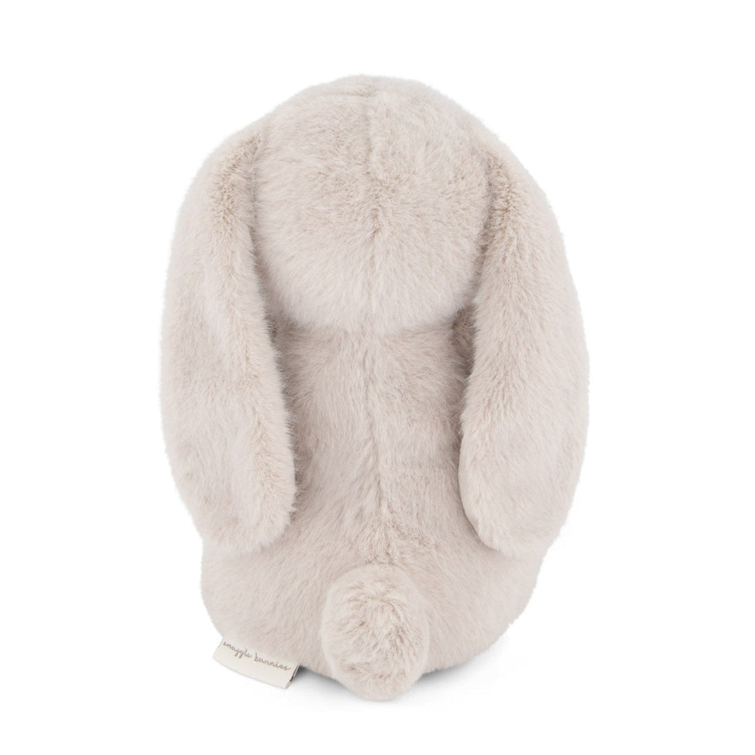 Back of a beige stuffed bunny with long ears and a fluffy tail.