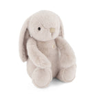 Light-beige plush bunny sitting.