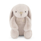 Stuffed bunny with long ears, furry texture, and heart detail.