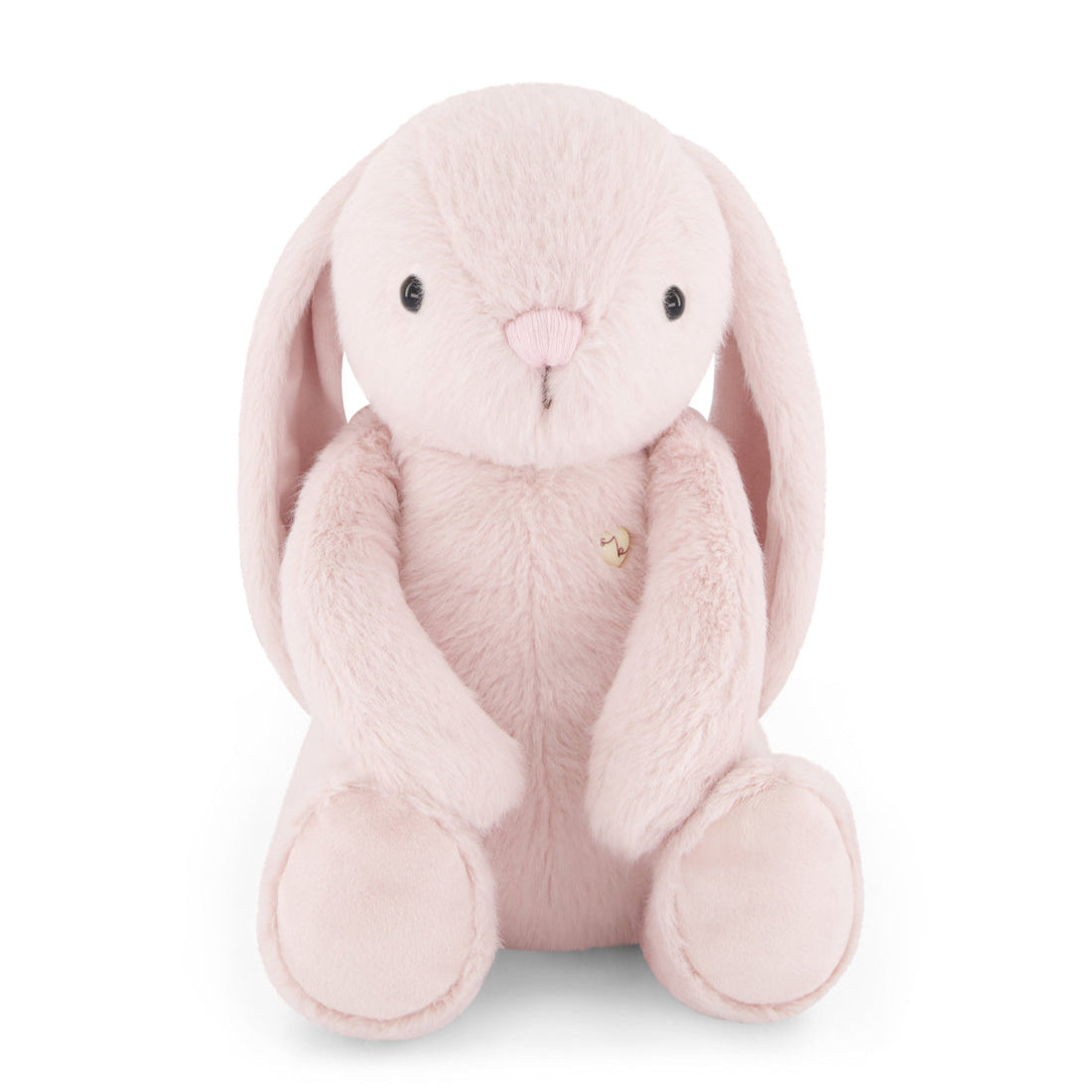 Pink plush bunny sitting.