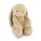 Tan plush bunny toy sitting upright.