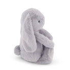 Gray plush rabbit sitting.