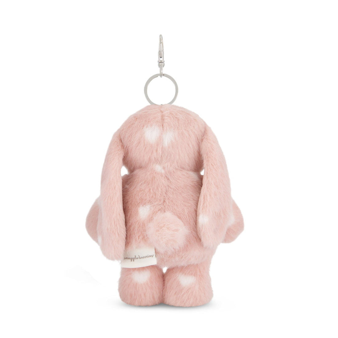 Back of a pink plush rabbit keychain with white heart spots.