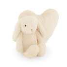 Beige bunny plush toy with heart.