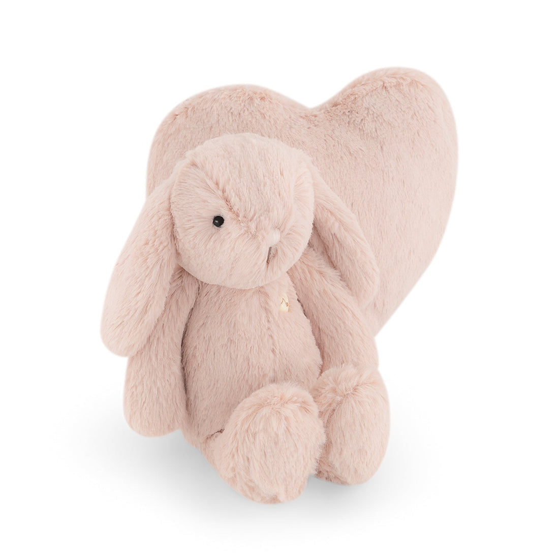 Stuffed pink bunny with a pink heart.