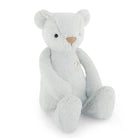 Light blue plush teddy bear sitting.