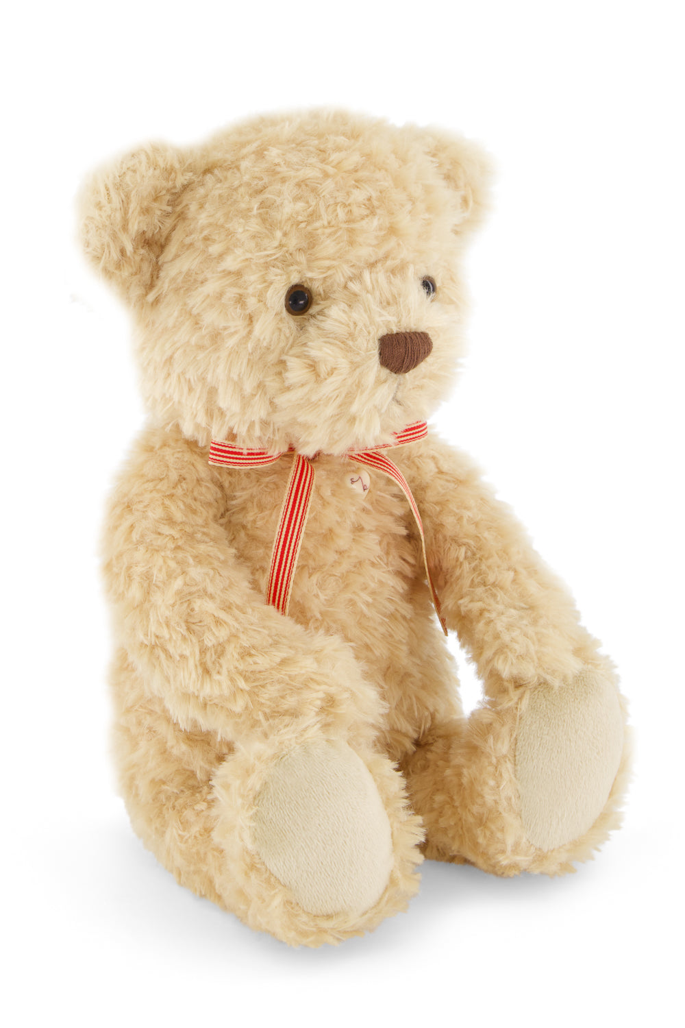 Beige teddy bear with a red ribbon on a white background
