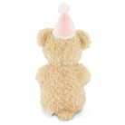 Back view of a beige teddy bear wearing a pink party hat.