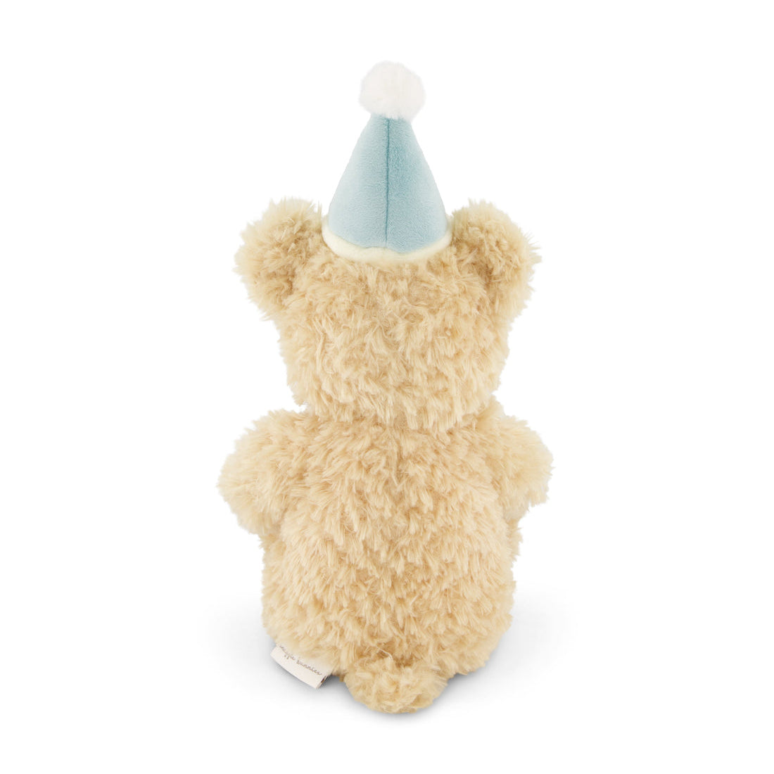 Rear view of a stuffed teddy bear wearing a light blue party hat with white pompom.