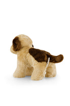 Side view of a brown and tan plush dog toy.