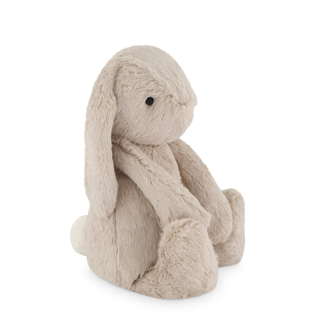 Beige stuffed bunny sitting on a white background.