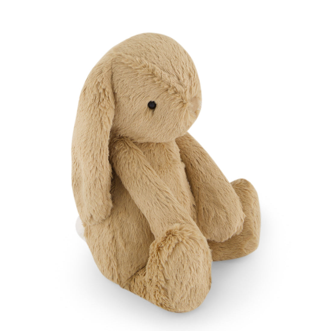 Tan plush bunny sitting.