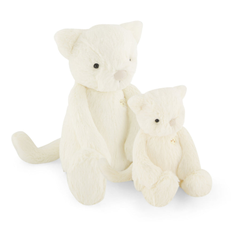 Two white plush toy cats.