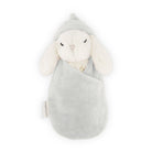 Stuffed bunny in blue blanket and cap.