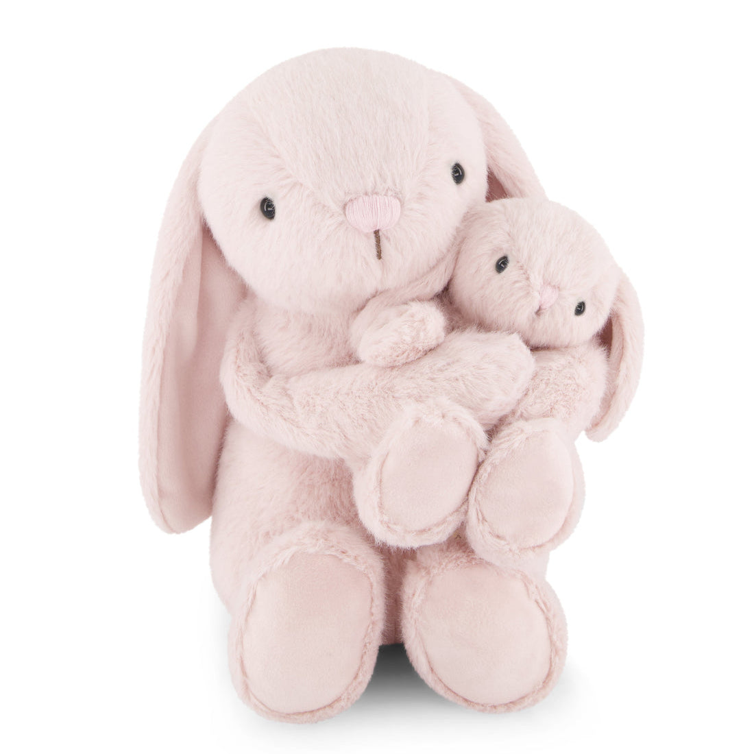 Two pink stuffed bunnies hugging.